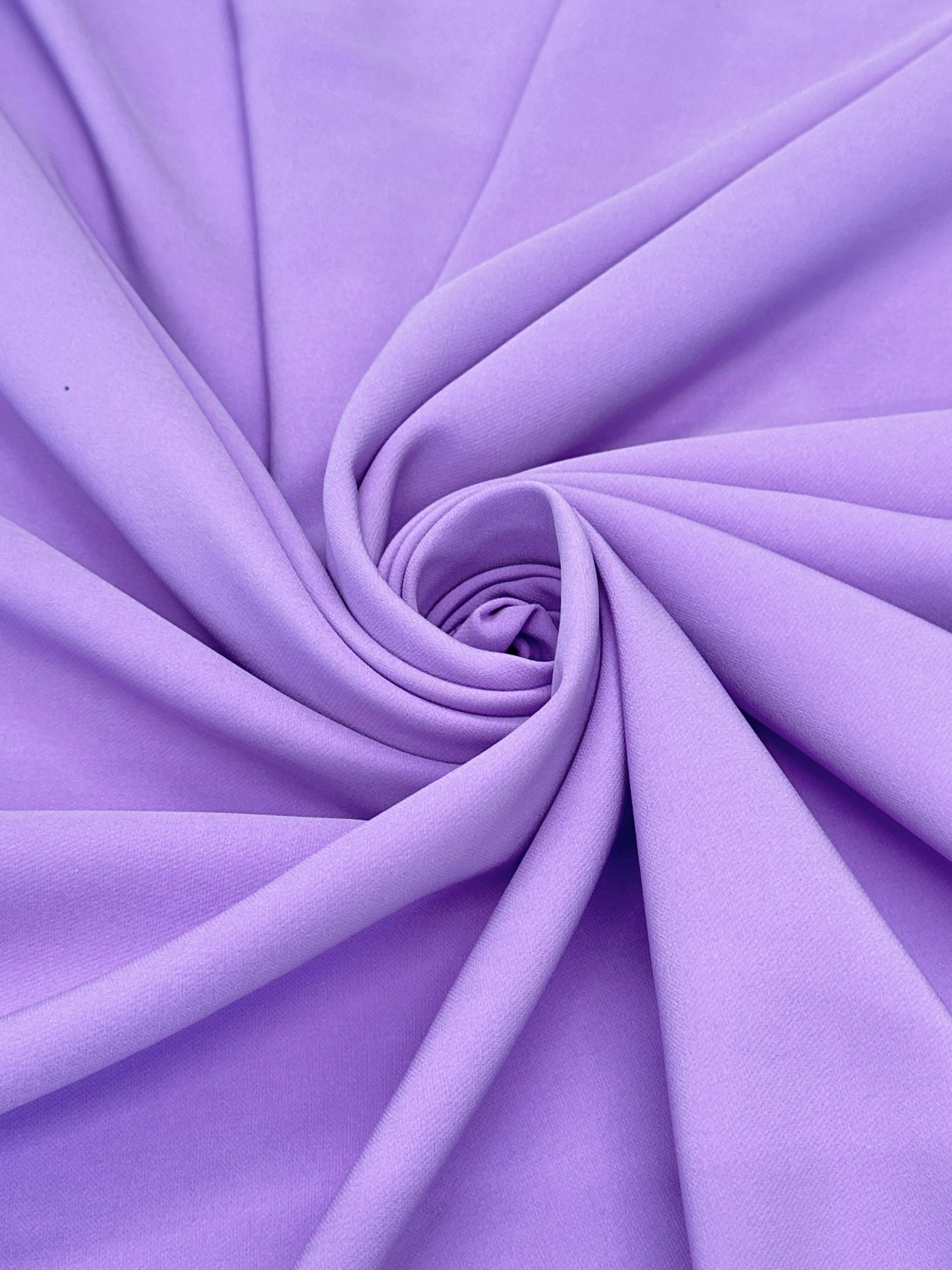 lavender stretch crepe, lavender color fabric, purple color fabric, purple dress for woman, light purple dress, best lavender color, fabric for woman, purple bridal dress, stretch bridal dress, cheap fabric, discounted fabric, buy fabric for woman online, luxury dress for woman, viscose crepe, crepe clothing material, wedding crepe, opac fabric, stretch crepe back satin