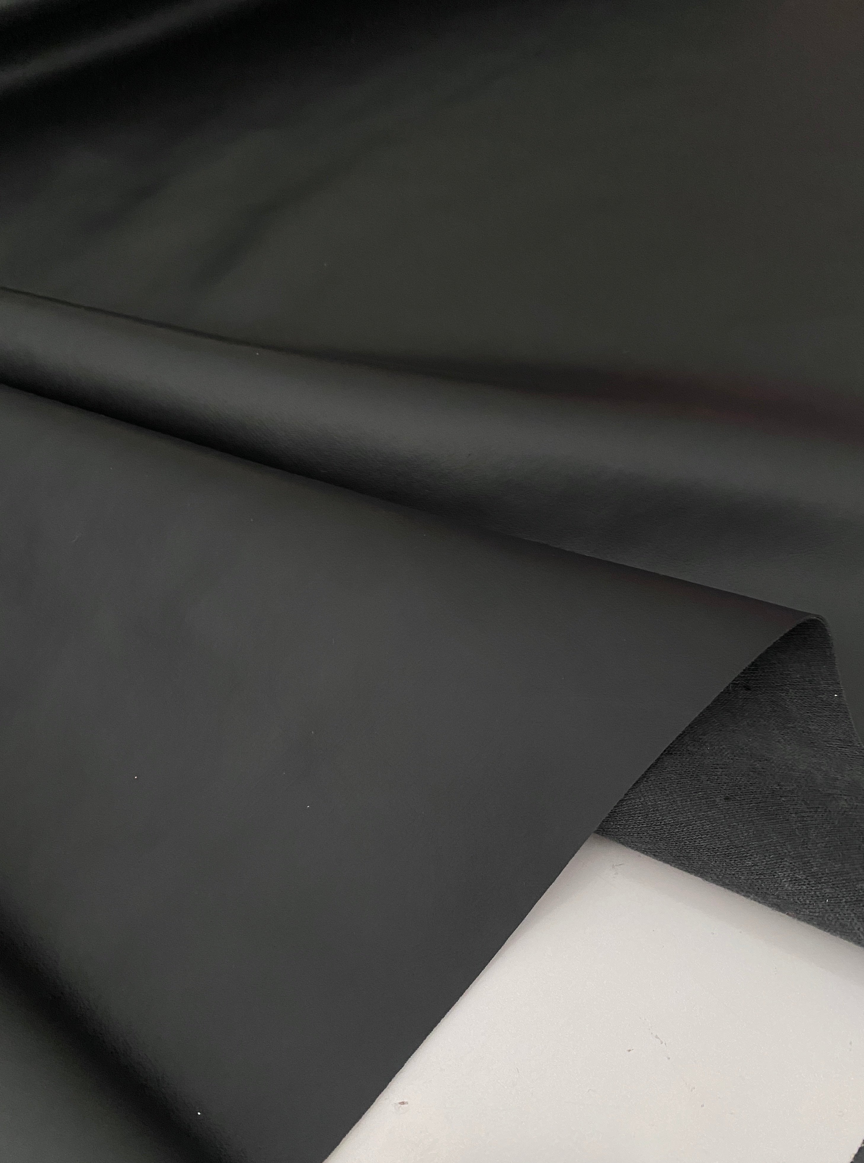 black upholstery vinyl, black vinyl, black faux leather, black leather, charcoal color, vinyl store usa, kiki textiles, leather on discount, vinyl fabric for pants, Black Matte Smooth Vinyl,  vinyl for Furniture,  vinyl for Jacket, Faux Leather by the yard, vinyl on discount, vinyl on sale