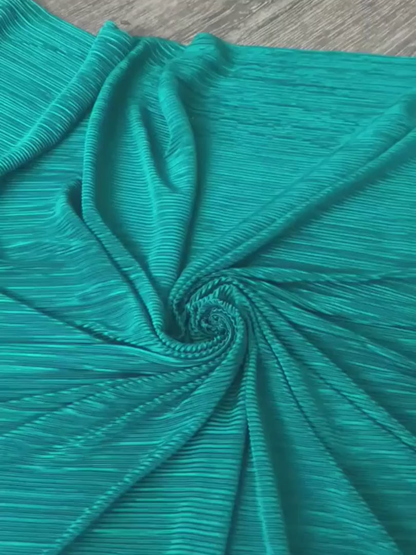 Teal Pleated Stretch Knit, blue Pleated Stretch Knit, light blue Pleated Stretch Knit, party wear Pleated Stretch Knit, shiny Pleated Stretch Knit for woman, Pleated Stretch Knit for bride, Pleated Stretch Knit on discount, Pleated Stretch Knit on sale, buy Pleated Stretch Knit online, Pleated Stretch Knit for gown