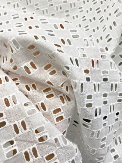 White Geometric Cotton Eyelet, cotton eyelets for woman, off white cotton eyelets, milky white cotton eyelets, cotton eyelet in low price, premium cotton eyelets, kiki textile cotton eyelets