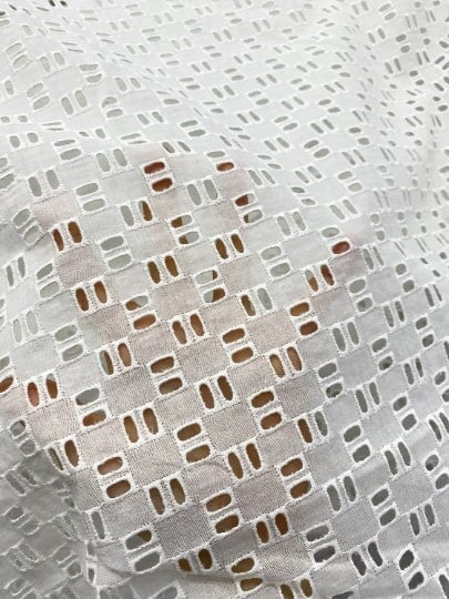 White Geometric Cotton Eyelet, cotton eyelets for woman, off white cotton eyelets, milky white cotton eyelets, cotton eyelet in low price, premium cotton eyelets, kiki textile cotton eyelets