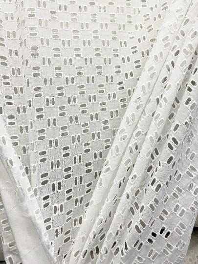White Geometric Cotton Eyelet, cotton eyelets for woman, off white cotton eyelets, milky white cotton eyelets, cotton eyelet in low price, premium cotton eyelets, kiki textile cotton eyelets