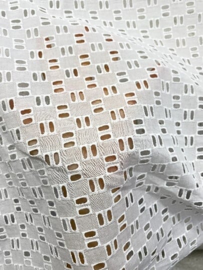 White Geometric Cotton Eyelet, cotton eyelets for woman, off white cotton eyelets, milky white cotton eyelets, cotton eyelet in low price, premium cotton eyelets, kiki textile cotton eyelets