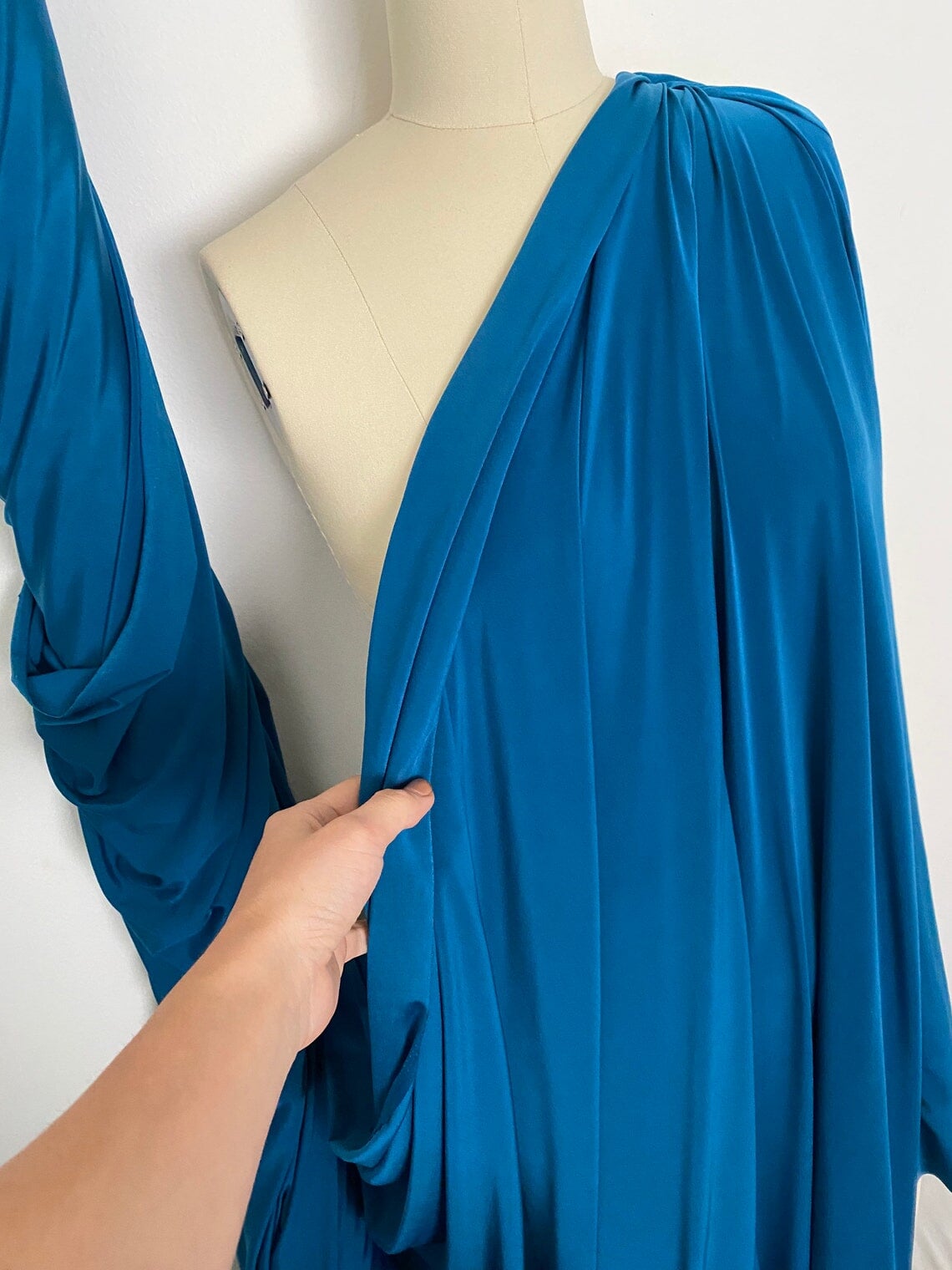 Teal Jersey ITY Spandex, blue ity knit, dark blue ity knit, shiny blue ity knit, ity knit for woman in teal blue, knit for costume, knit for sweatpants, knit for gown, knit on discount, knit in low price, ity fabric on sale