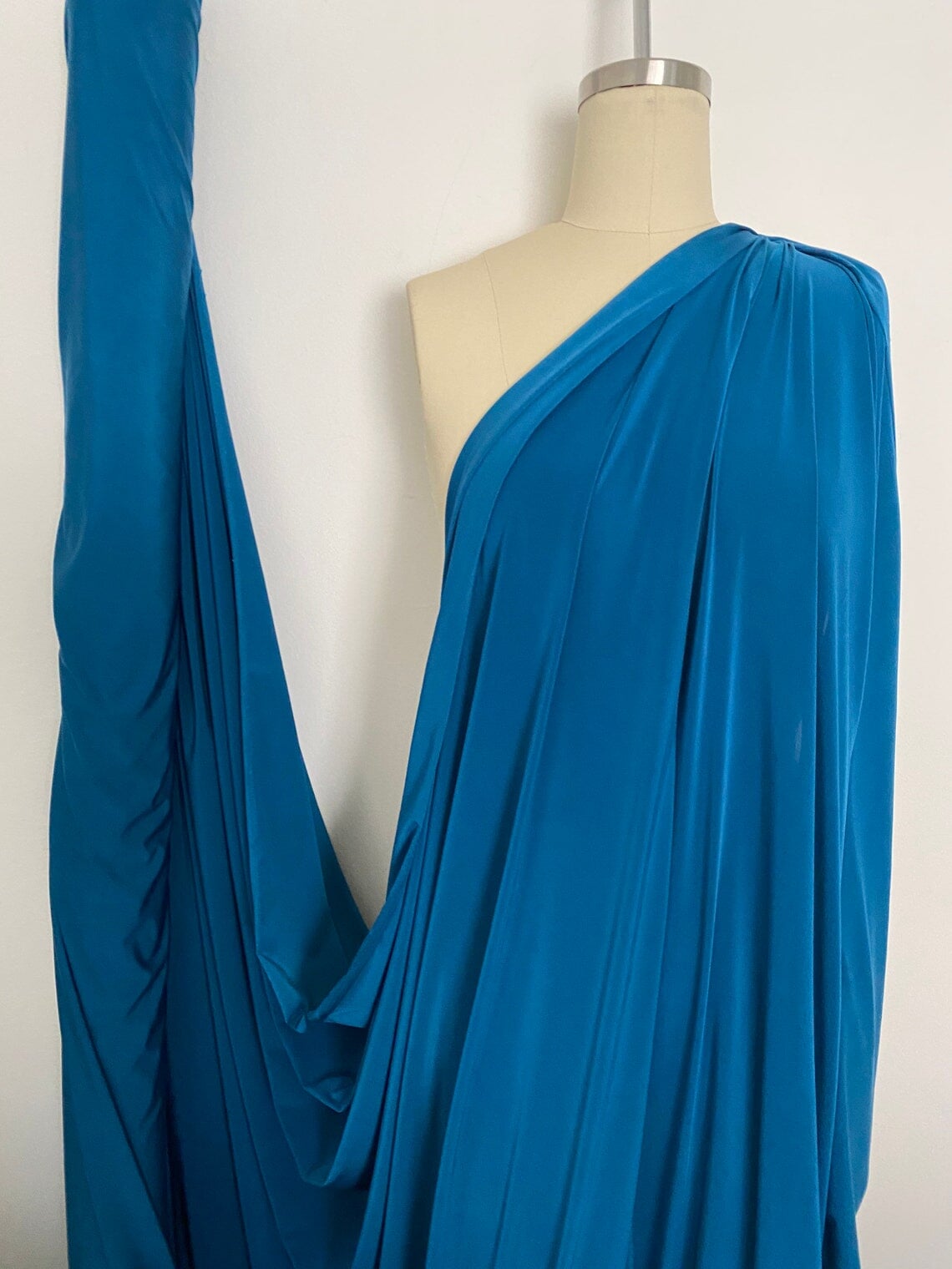 Teal Jersey ITY Spandex, blue ity knit, dark blue ity knit, shiny blue ity knit, ity knit for woman in teal blue, knit for costume, knit for sweatpants, knit for gown, knit on discount, knit in low price, ity fabric on sale