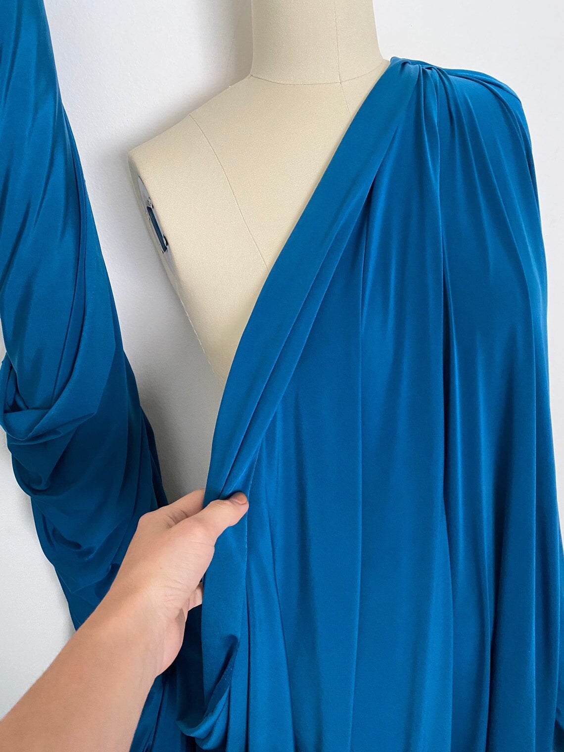 Teal Jersey ITY Spandex, blue ity knit, dark blue ity knit, shiny blue ity knit, ity knit for woman in teal blue, knit for costume, knit for sweatpants, knit for gown, knit on discount, knit in low price, ity fabric on sale