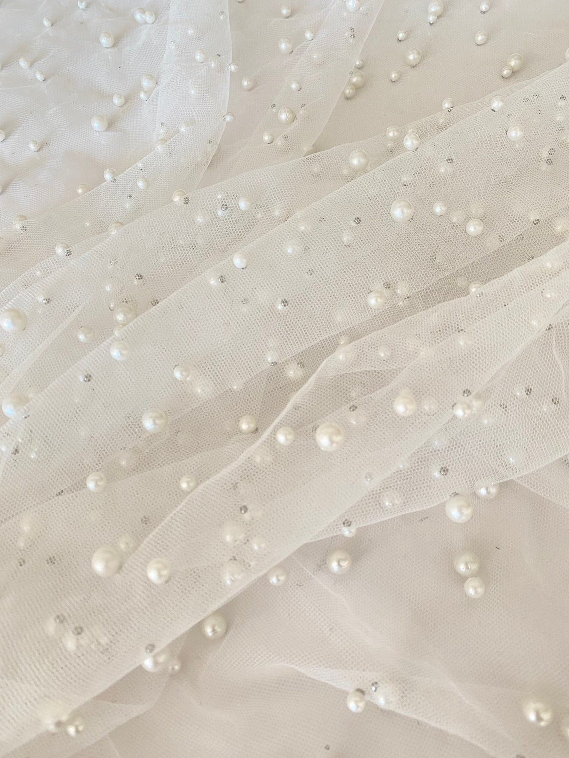 off white Pearl Tulle, white pearl Tulle, bright white pearl tulle, milky white Pearl Tulle, shinny Pearl Tulle, Pearl Tulle for woman, Pearl Tulle for bride, Pearl Tulle on discount, Pearl Tulle on sale, premium Pearl Tulle, buy Pearl Tulle online