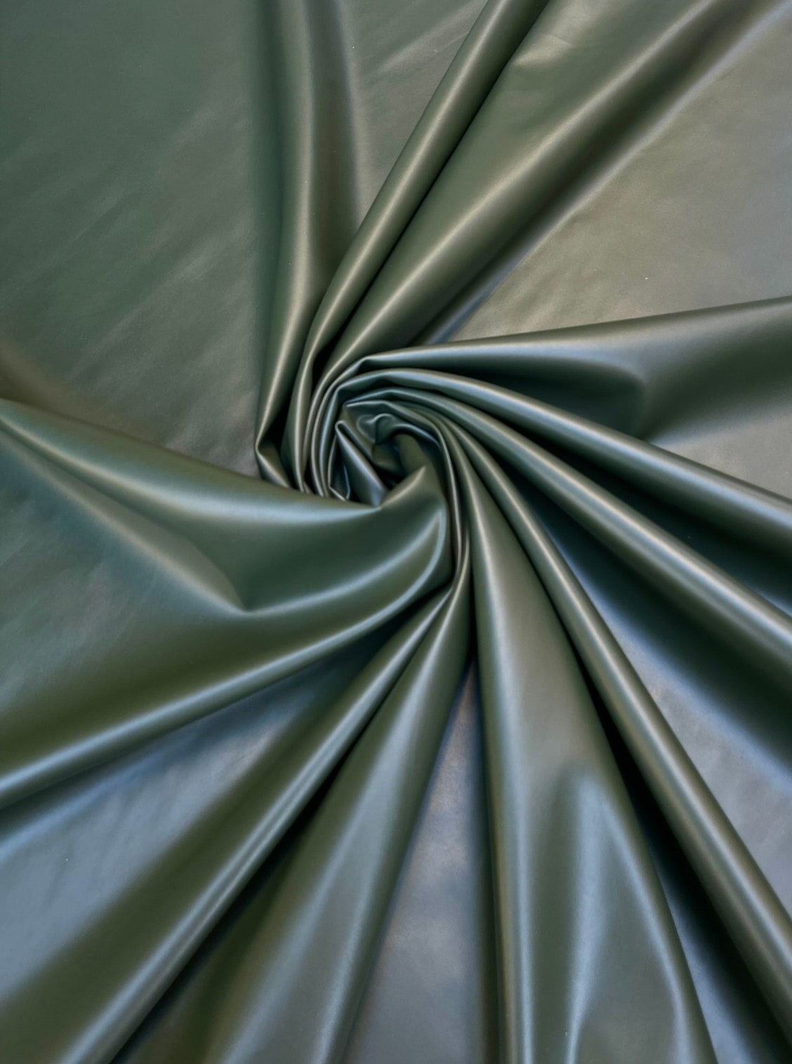 olive green stretch faux leather, olive stretch pleather, olive green stretch soft vinyl, olive green stretch vinyl, faux leather stretch for clothing, Faux Leather for jackets, Faux Leather for bags, Faux Leather on discount, Faux Leather on sale, premium Faux Leather, green Faux Leather, light green Faux Leather, Faux Leather for tops, Faux Leather for leggings