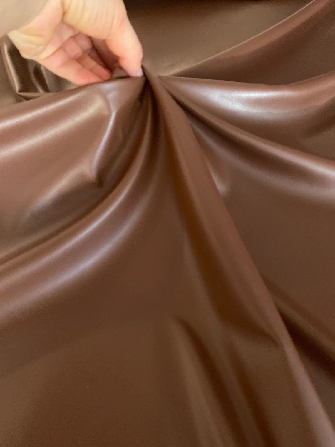 Chocolate stretch faux leather, Chocolate stretch pleather, Chocolate stretch soft vinyl, Chocolate stretch vinyl, faux leather stretch for clothing, Faux Leather for jackets, Faux Leather for bags, Faux Leather on discount, Faux Leather on sale, premium Faux Leather, dark brown Faux Leather, brown Faux Leather, Faux Leather for tops, Faux Leather for leggings