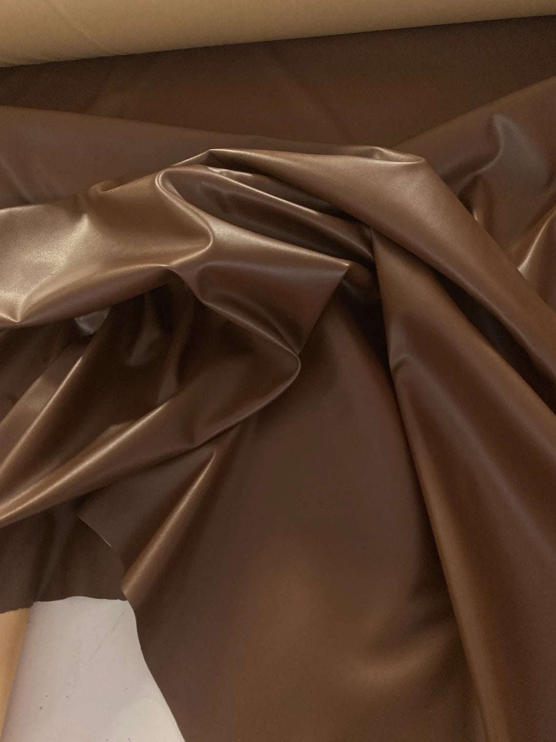 Chocolate stretch faux leather, Chocolate stretch pleather, Chocolate stretch soft vinyl, Chocolate stretch vinyl, faux leather stretch for clothing, Faux Leather for jackets, Faux Leather for bags, Faux Leather on discount, Faux Leather on sale, premium Faux Leather, dark brown Faux Leather, brown Faux Leather, Faux Leather for tops, Faux Leather for leggings