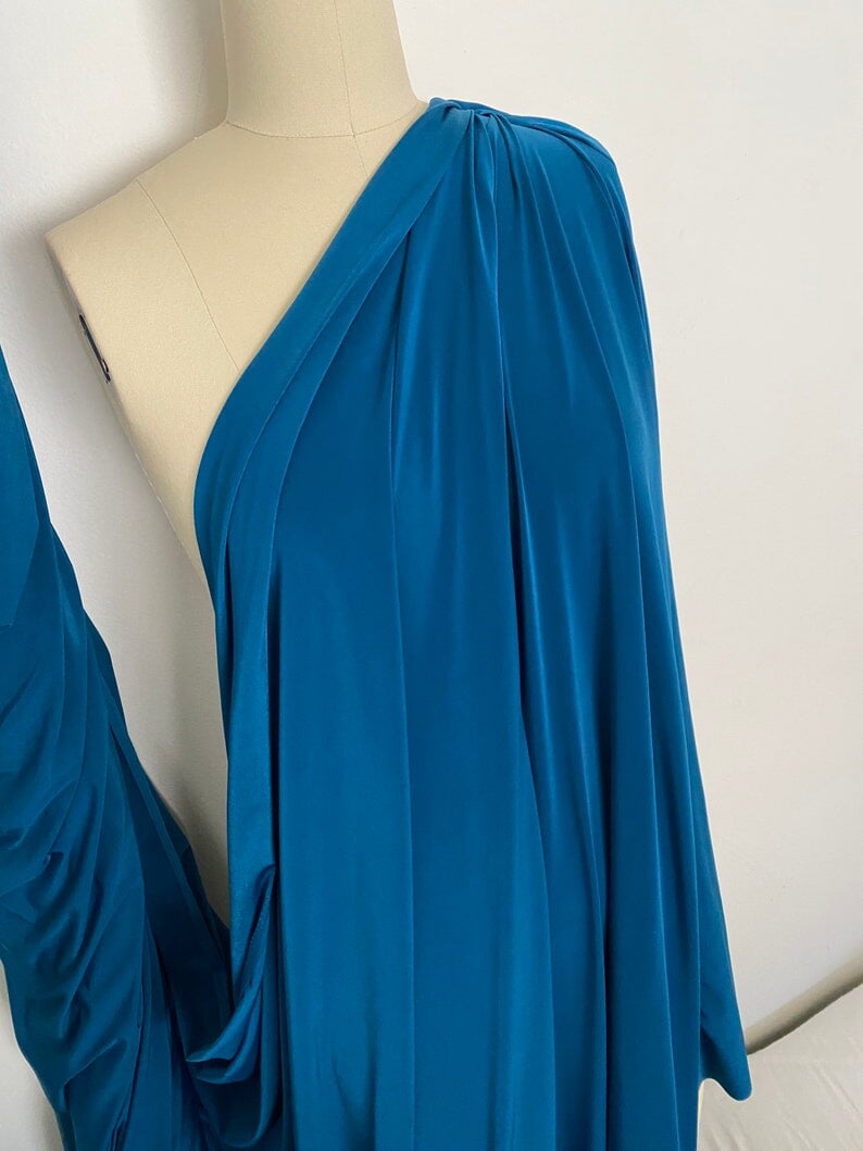 Teal Jersey ITY Spandex, blue ity knit, dark blue ity knit, shiny blue ity knit, ity knit for woman in teal blue, knit for costume, knit for sweatpants, knit for gown, knit on discount, knit in low price, ity fabric on sale