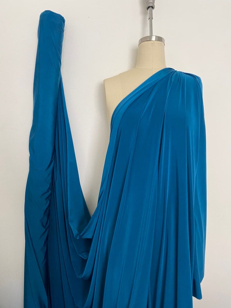 Teal Jersey ITY Spandex, blue ity knit, dark blue ity knit, shiny blue ity knit, ity knit for woman in teal blue, knit for costume, knit for sweatpants, knit for gown, knit on discount, knit in low price, ity fabric on sale