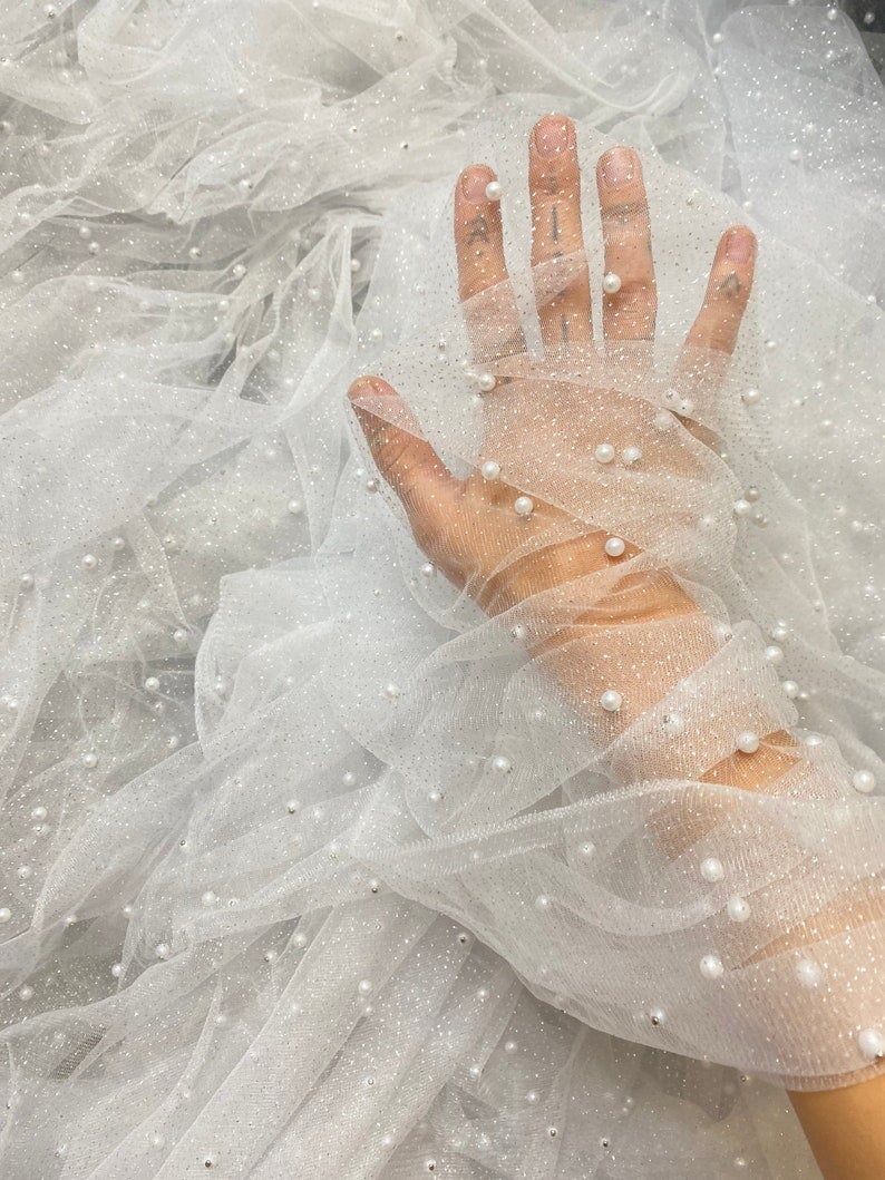 white Tulle Bead Pearl Lace Fabric, off white Pearl Beaded Tulle for Veil, bright white Beaded Pearl Tulle Lace Fabric by the yard, milky white pearl scattered tulle, Pearl Tulle Fabric for woman, Pearl Tulle Fabric for party wear, Pearl Tulle Fabric on discount,Pearl Tulle Fabric on sale