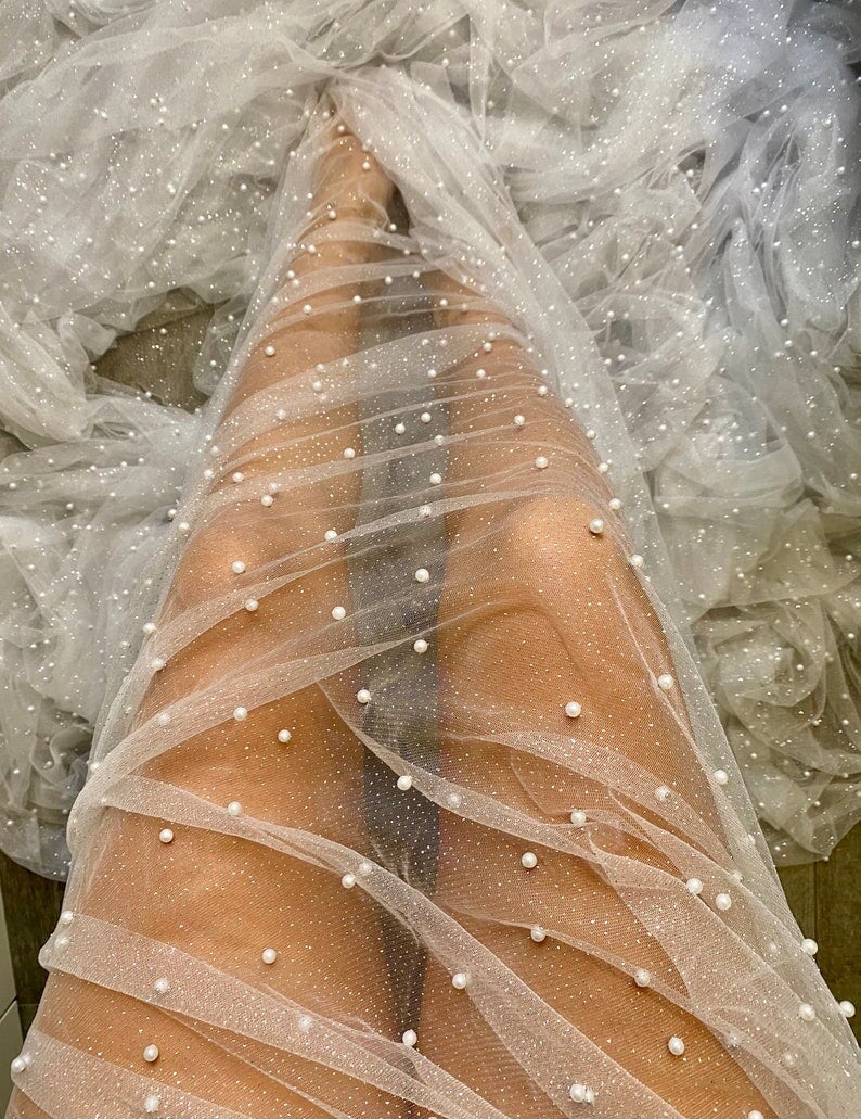 white Tulle Bead Pearl Lace Fabric, off white Pearl Beaded Tulle for Veil, bright white Beaded Pearl Tulle Lace Fabric by the yard, milky white pearl scattered tulle, Pearl Tulle Fabric for woman, Pearl Tulle Fabric for party wear, Pearl Tulle Fabric on discount,Pearl Tulle Fabric on sale