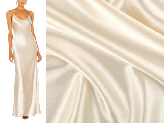 model wearing elegant gown of ivory silk satin fabric 