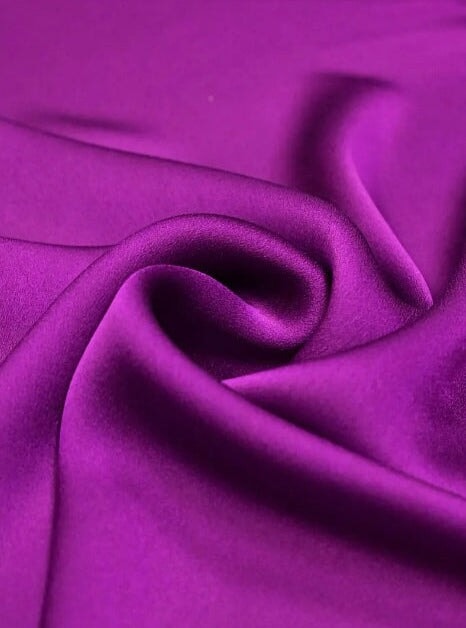 purple satin fabric drape in spirals