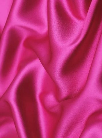 close up of a pink silky stretch satin